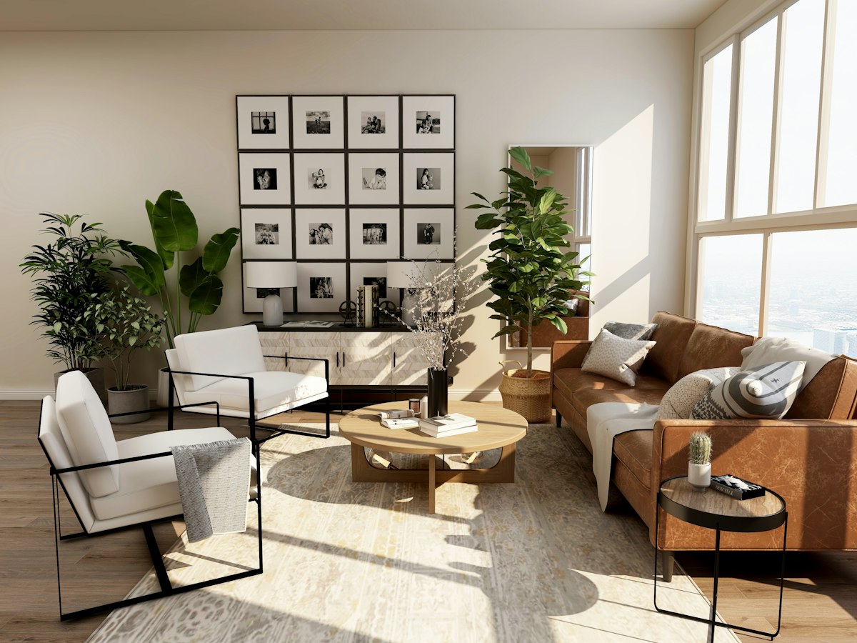 Warm renovated living room with indoor plants and a gallery wall in afternoon light