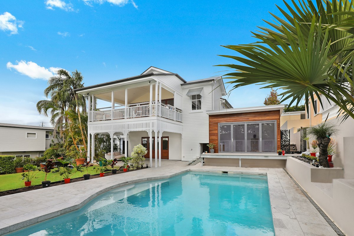 Classic Queenslander-style Australian home with a sympathetic modern addition and pool